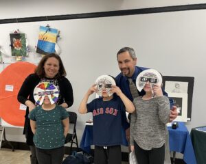 Students and teachers with their eclipse masks.